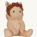 Olli Ella light sand coloured Bubba Bunny Dinky Dinkum Doll in a seated position. The bunny ear hood has been pulled back showing the curly red coloured hair. 