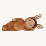 Olli Ella toffee coloured Bucky Bunny Dinky Dinkum Doll in a side laying position.