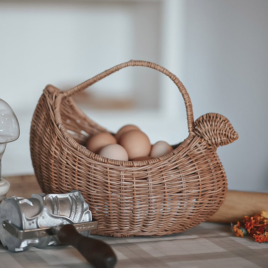 Close up of the Olli Ella woven rattan chicken basket