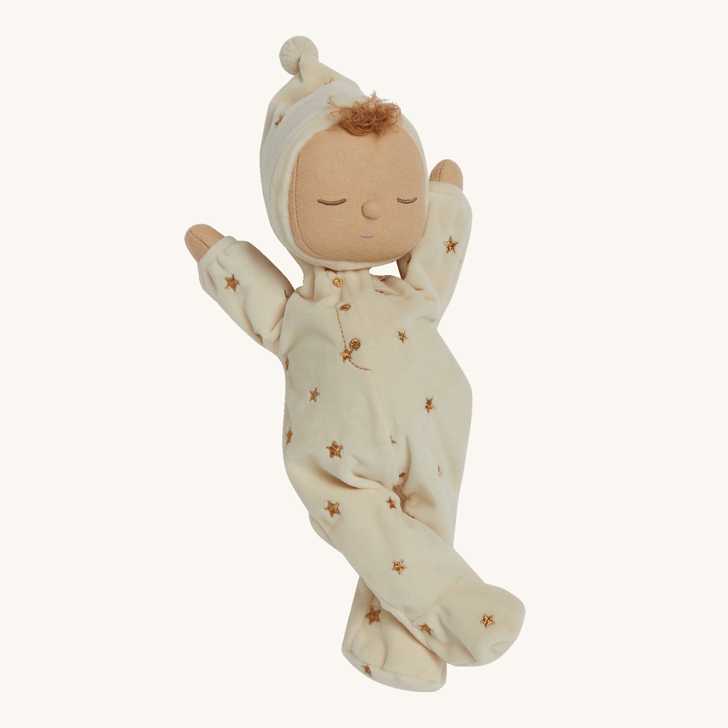 and a non-removable buttercream soft velvet onesie with golden embroidered stars.