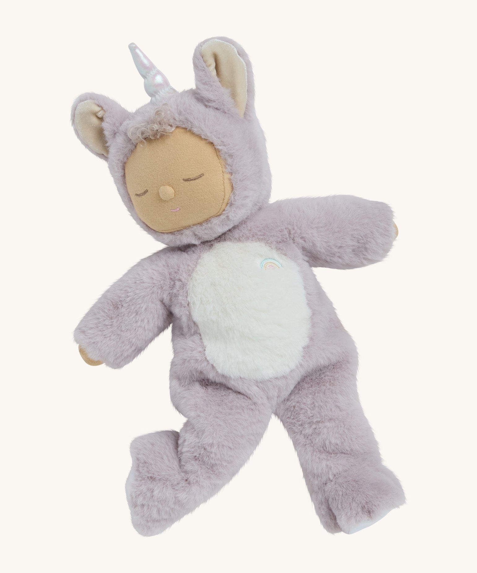 A posing lilac fluffy unicorn Olli Ella dozy dinkum doll on a cream background