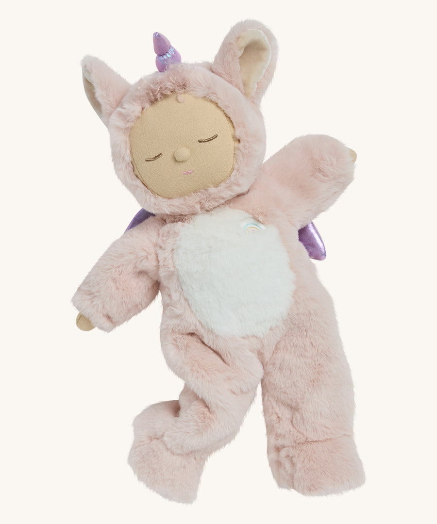 A posing pink fulffy Olli Ella unicorn dinkum doll on a cream background