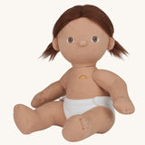 An Olli Ella Dottie Dinkum Doll on a plain background. The doll has brown hair and brown eyes. The hair is in pig tails and the doll is a seated position with just the nappy on. 