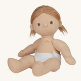 An Olli Ella Gigi Dinkum doll. The doll has blonde hair in pig tails and brown eyes. The doll is in a seated position and is wearing a white nappy. Shown on a plain background.  