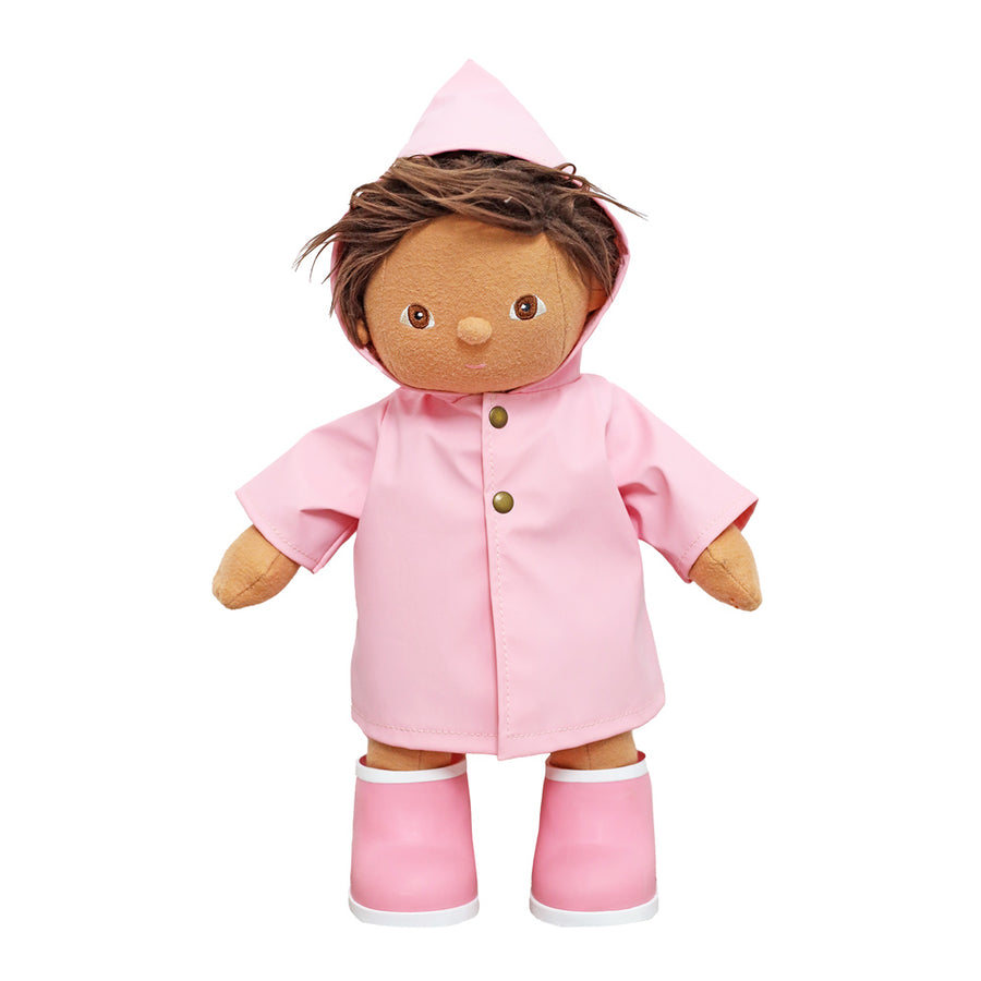 Olli ella dinkum doll toy stood on a white background wearing the pink rainy play set