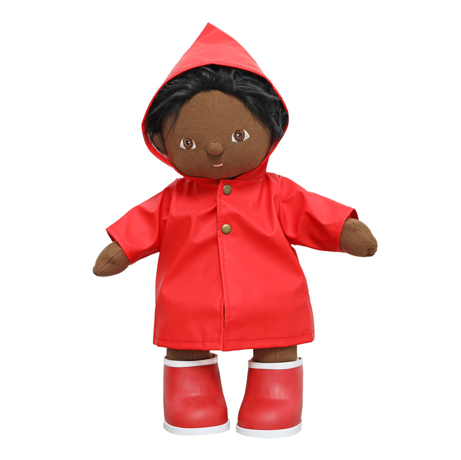 Olli Ella dinkum doll toy stood on a white background wearing the red rainy play set