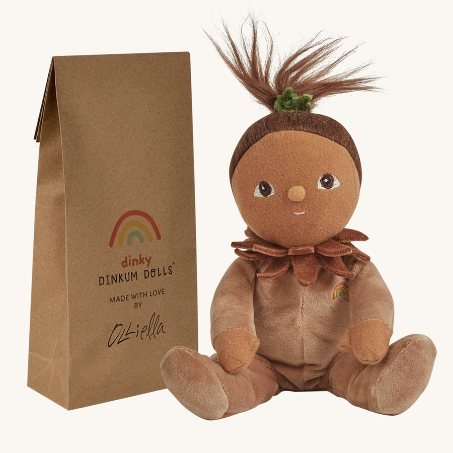 Olli Ella Dinky Dinkum Doll - Allie Acorn. The doll faces forward and sits next to its packaging.