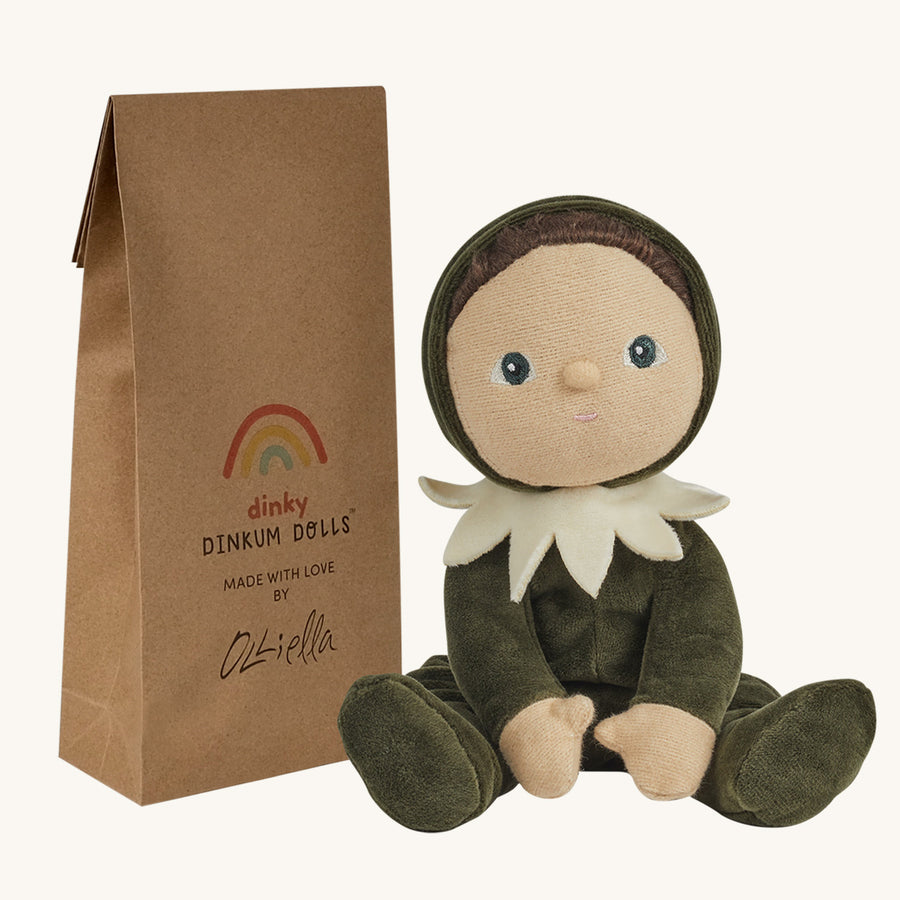 Olli Ella Dinky Dinkum Doll - Percy Pine. The Doll faces forward and sits next to its packaging.