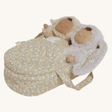 Two Dozy Dinkums laying side by side inside the Olli Ella Garden Floral Gardenia print Dinkum Dolls Quilted Carry Cot 
