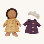 Olli Ella Dress Me Dinky - Lila Lavender wearing a yellow dress with a purple fleece trench coat and white beret beside her. Cream background. 