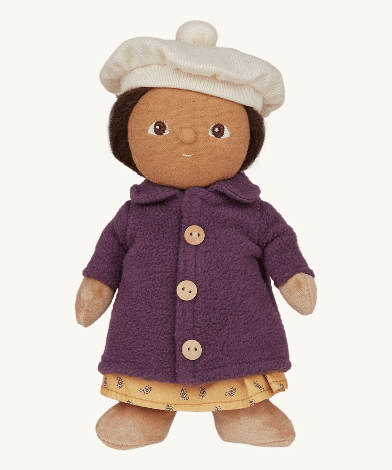 Olli Ella Dress Me Dinky - Lila Lavender wearing a purple fleece trench coat, yellow dress and white beret. Cream background. 