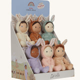 Olli Ella Dinky Dinkum Fluffle Family Bunny Dolls in their cardboard display stand. There are 6 bunnies in total including Babbit, Babs, Basil, Bubba, Biscuit and Bucky. The box is pictured at an angle showing the illustrations of the bunnies on the side of the stand.