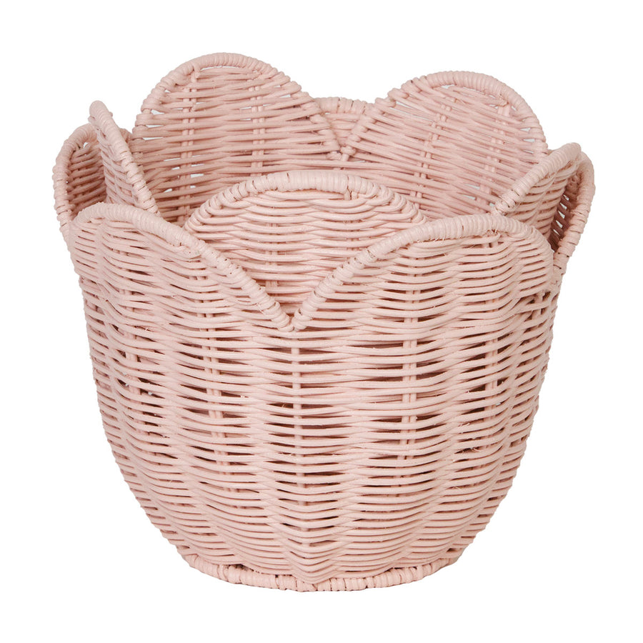 Olli Ella handmade woven rattan lily basket in the rose pink colour on a white background