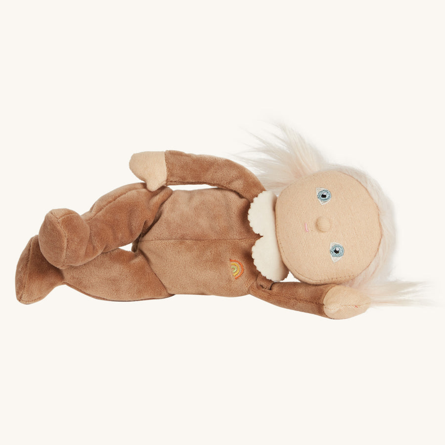 Olli ella soft dinky dinkum doll toy laying on a beige background