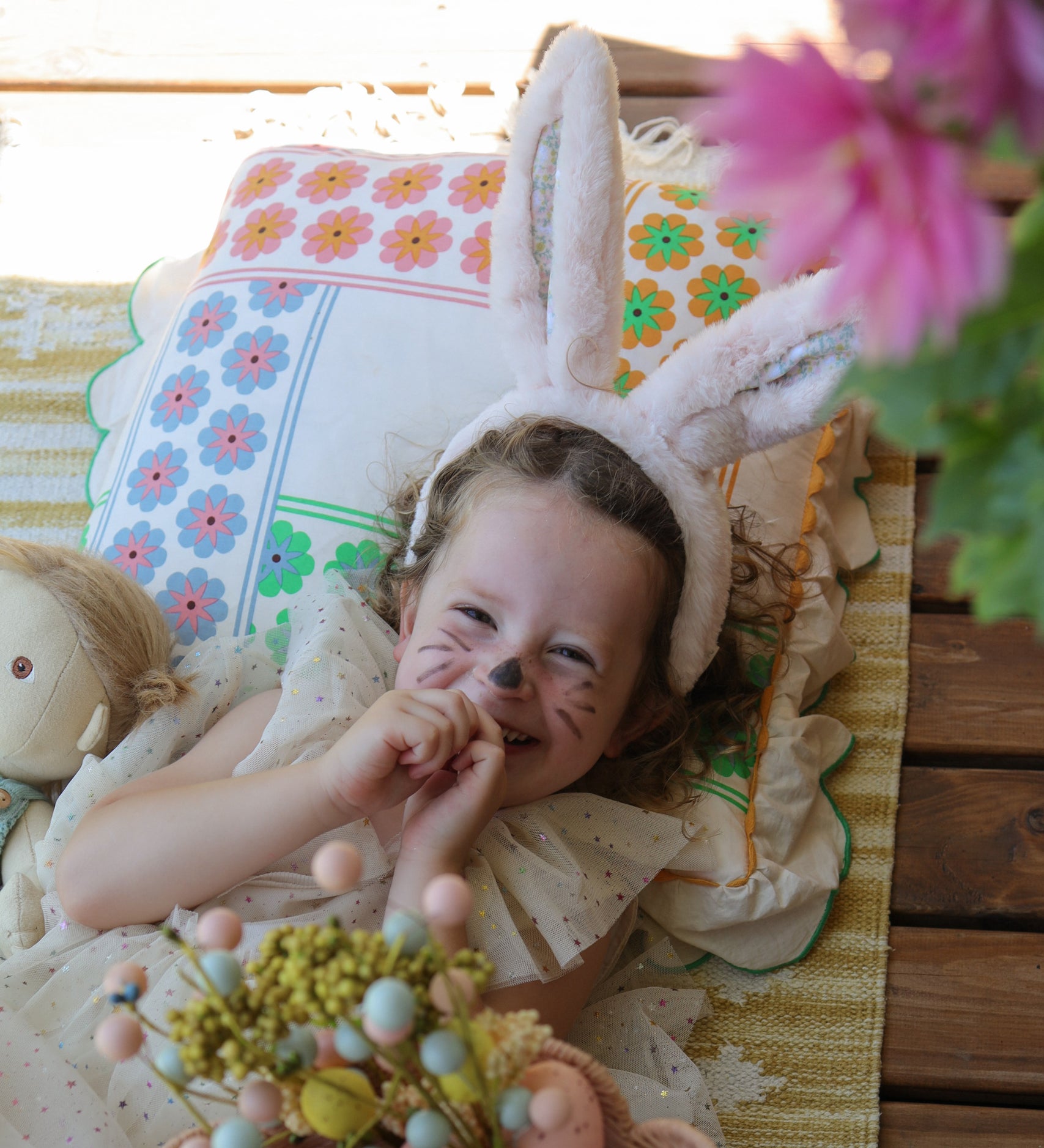 A child wearing the pink Olli Ella Fluffle Bunny Ear Headband in Pink.