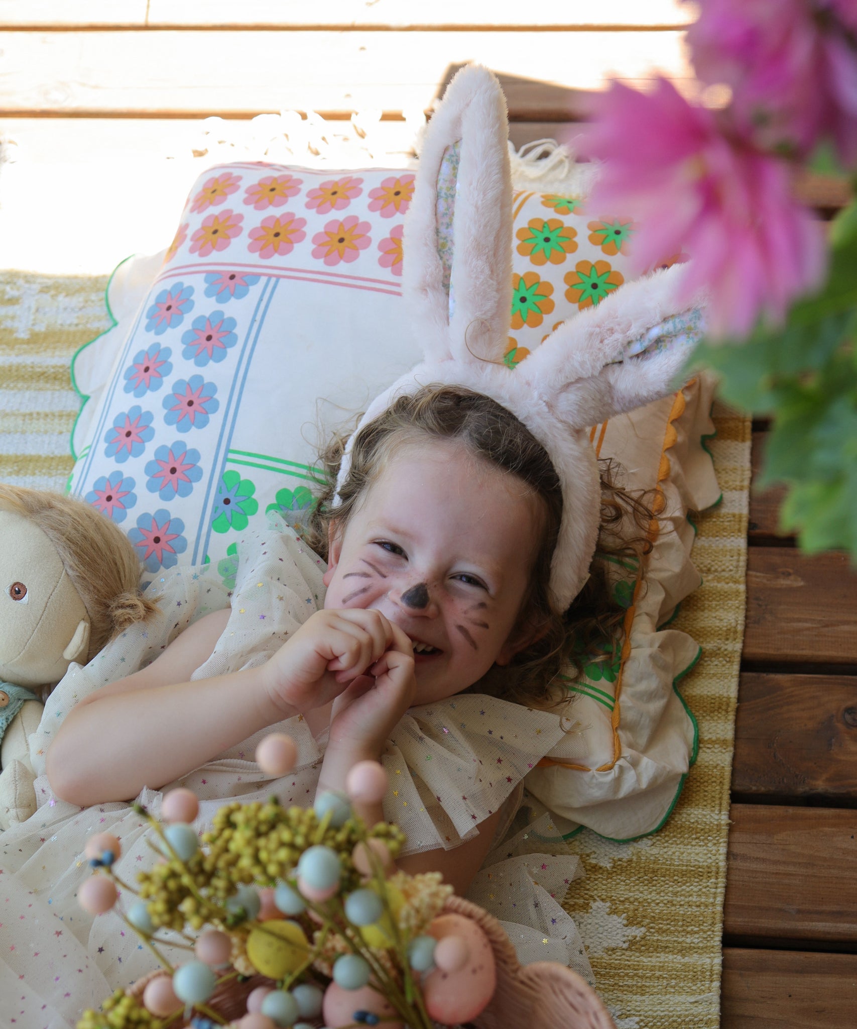 A child wearing the pink Olli Ella Fluffle Bunny Ear Headband in Pink.