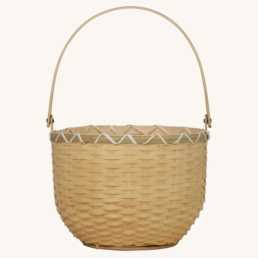 Olli Ella Nude Big Blossom Basket pictured on a plain beige background