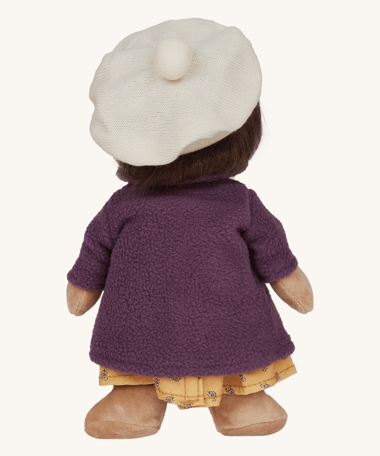 Olli Ella Dress Me Dinky - Lila Lavender wearing a purple fleece trench coat, yellow dress and white beret. Rear view, cream background. 