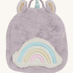  A lilac Olli Ella fluffy unicorn backpack with a rainbow on the front on a cream background.