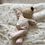 and a non-removable ballet pink soft velvet onesie with golden embroidered stars.