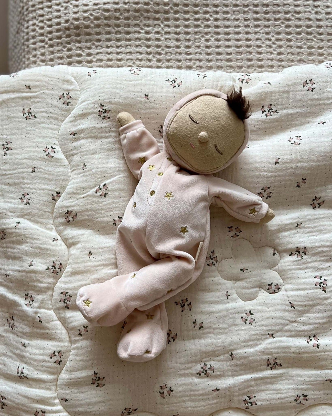 and a non-removable ballet pink soft velvet onesie with golden embroidered stars.