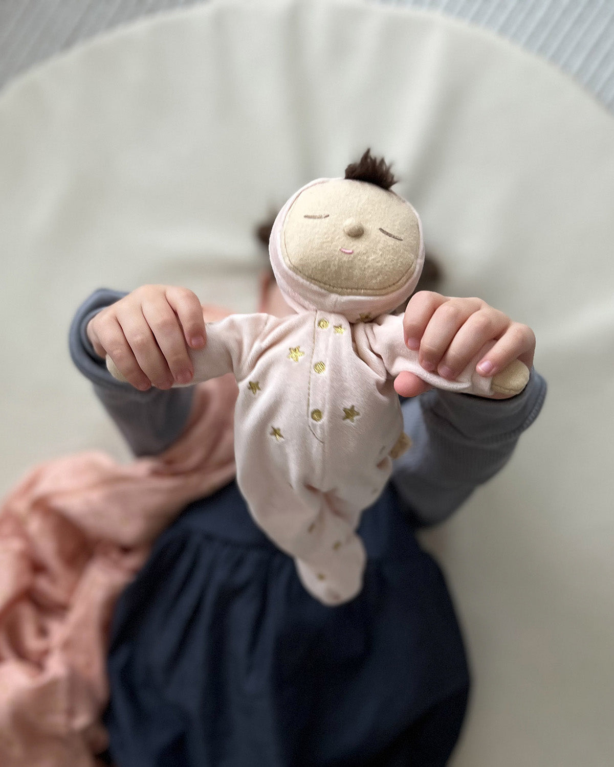 Olli Ella Lullaby Dozy Dinkum Doll - Luna is posed in a sitting position on a cushion.