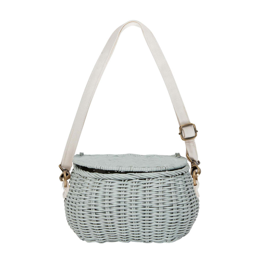 Olli ella natural rattan mini chari bag in the vintage blue colour on a white background