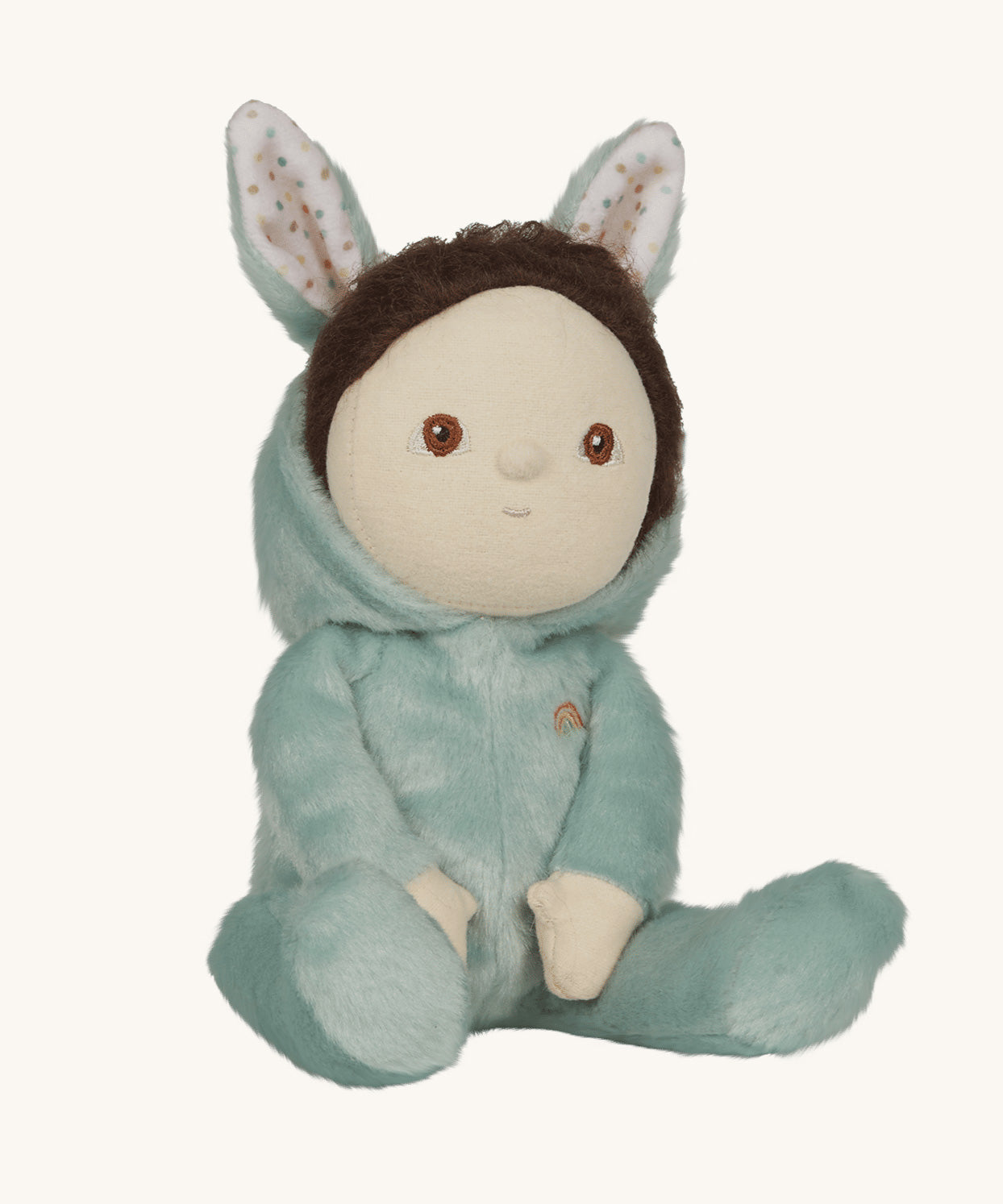 Olli Ella mint green coloured Biscuit Bunny Dinky Dinkum Doll in a seated position, The dolls dark brown coloured hair can be seen peeping out at the front.