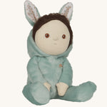 Olli Ella mint green coloured Biscuit Bunny Dinky Dinkum Doll in a seated position, The dolls dark brown coloured hair can be seen peeping out at the front.