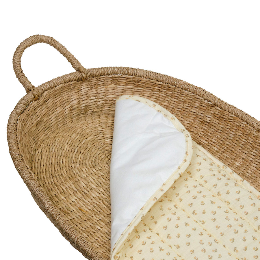 3 Olli Ella organic cotton luxe liner basket cushions inside an Olli Ella rattan basket on a white background