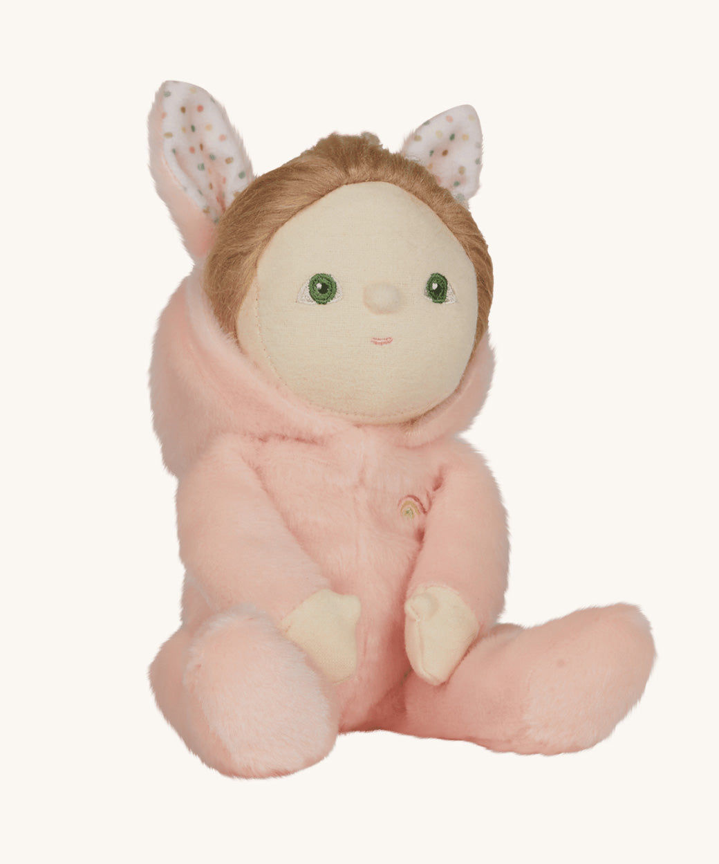 Olli Ella pink coloured Babbit Bunny Dinky Dinkum Doll in a seated position, the bunny ear hood has been pulled down showing the dolly's blond coloured hair.