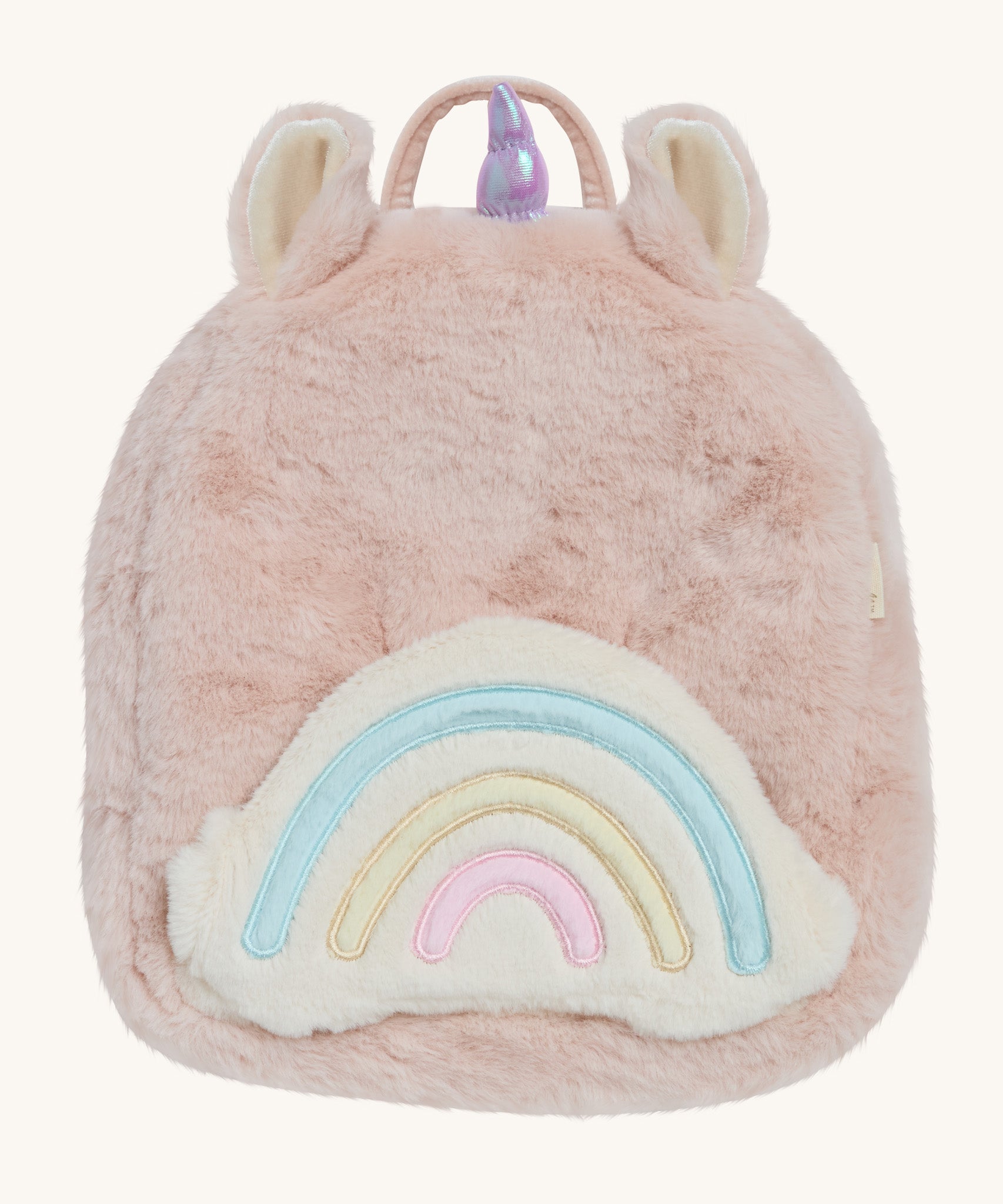 A OIli Ella pink fluffy unicorn backpack with a rainbow on the front on a cream background.