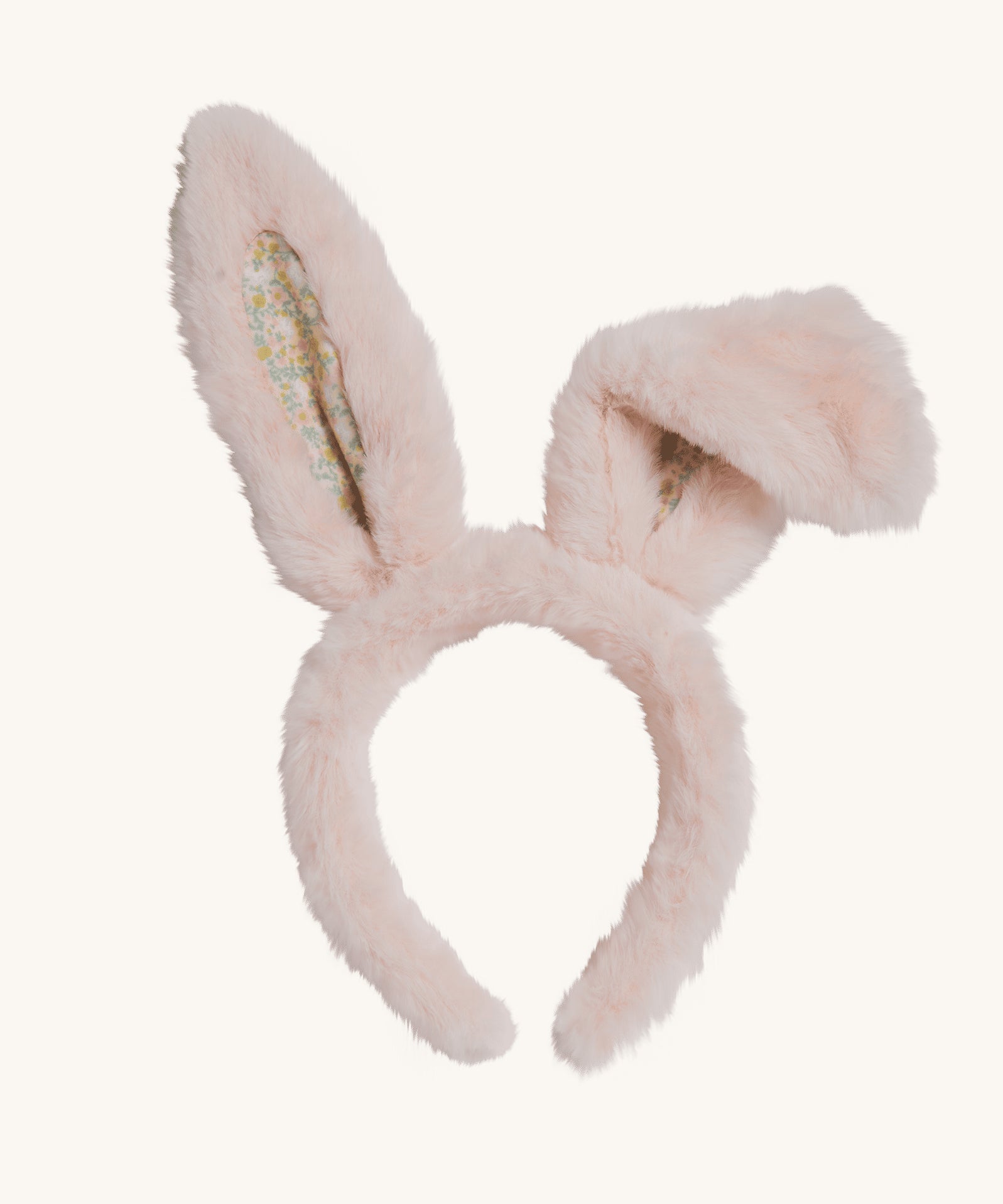 The Olli Ella Fluffle Bunny Ear Headband in Pink on a plain background. One ear is shown folded over.