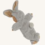 Olli Ella Pip Lullaby Cozy Dinkum Bunny laying on it's front on a plain background.