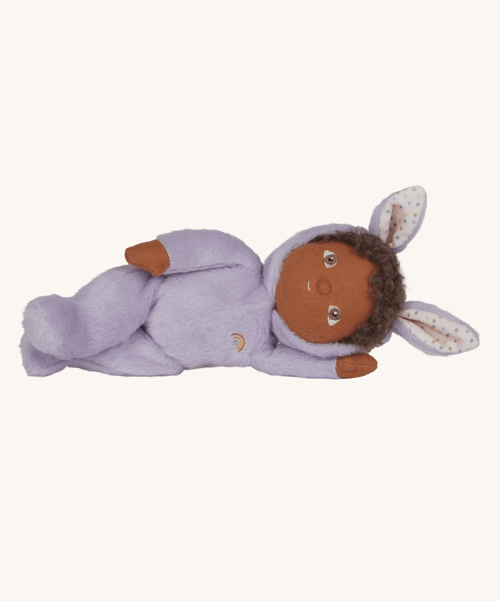 Olli Ella purple coloured Babs Bunny Dinky Dinkum Doll in a side laying position.