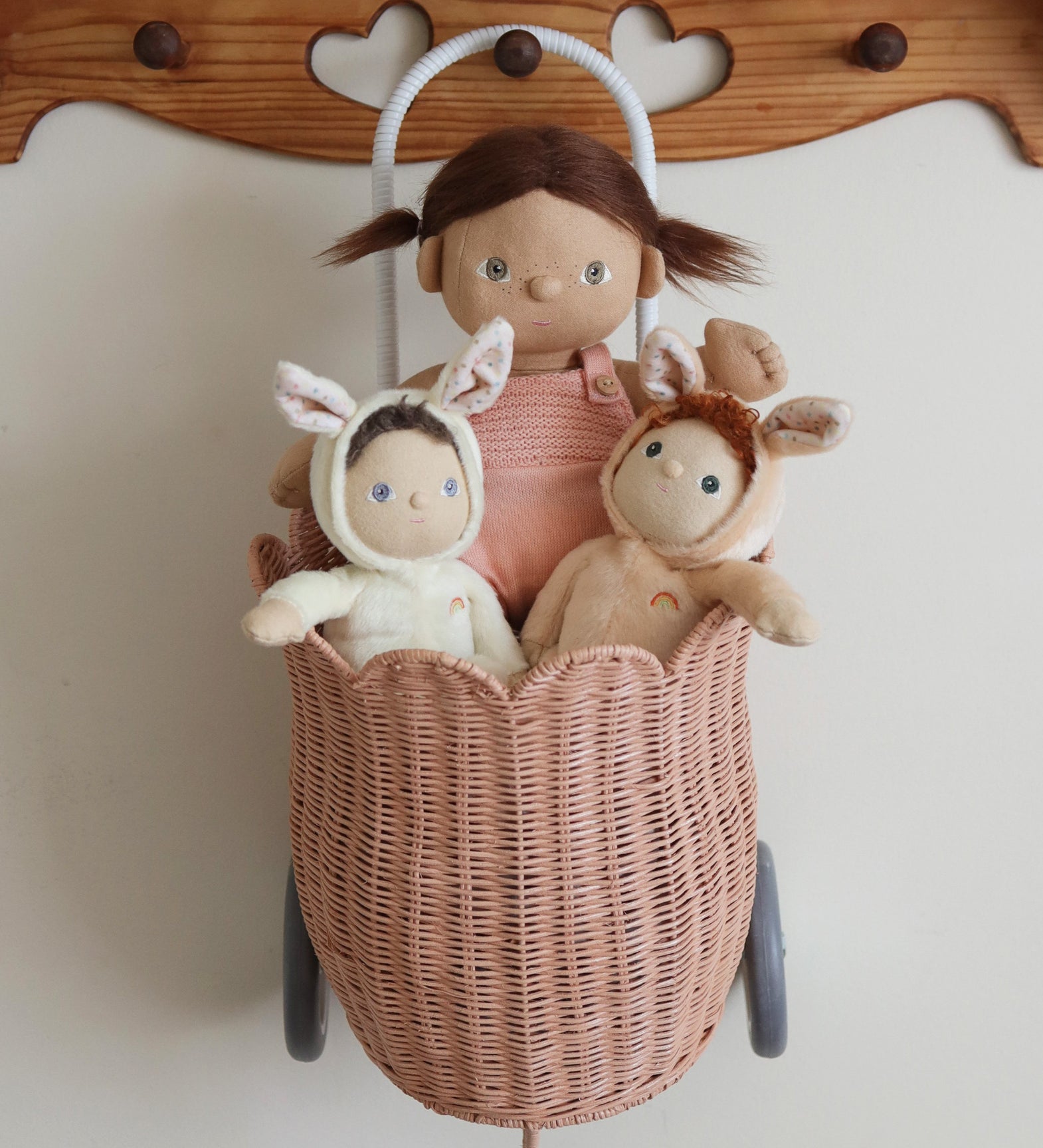 Two Olli Ella Bunny Dinky Dinkum Dolls in a pink basket with a Dinkum doll