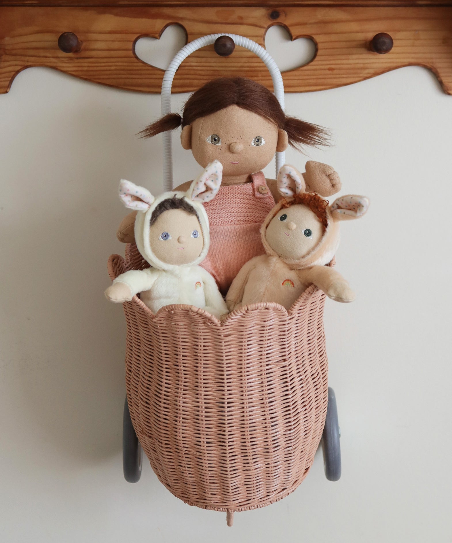 Two Olli Ella Bunny Dinky Dinkum Dolls in a pink basket with a Dinkum doll