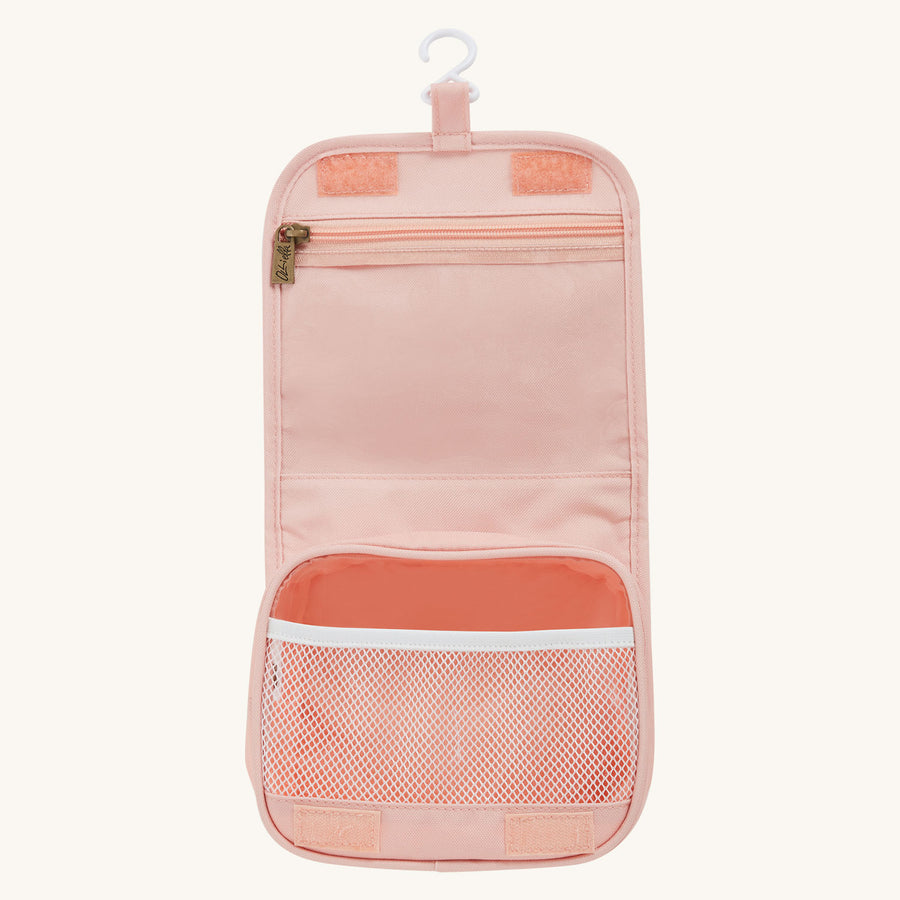 Olli Ella See-Ya Wash Bag with a Pink Daisies print shown open pictured on a plain background