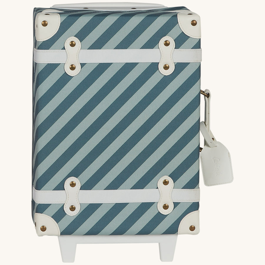 Olli Ella See-Ya Kids Travel Suitcase - Boardwalk. A kids-sized suitcase for mini travellers in a striped light and dark blue print, white details with metal studs, on a cream background