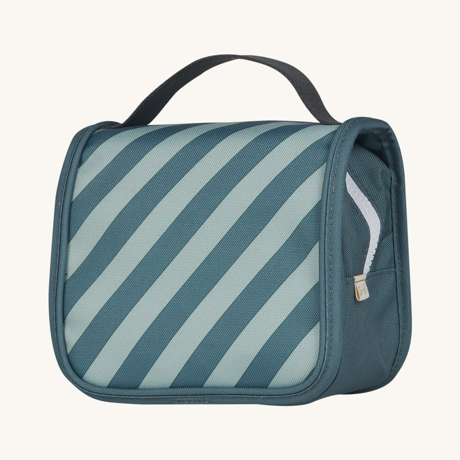 Olli Ella See-Ya Kids Travel Wash Bag - Boardwalk. A Light and Dark blue striped print kids travel washbag, on a cream background