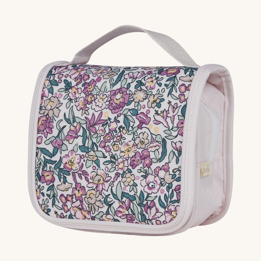 Olli Ella See-Ya Kids Travel Wash Bag - Wildflower Floral. A pale lilac kids-sized travel wash bag with a vintage wildflower floral print, on a cream background