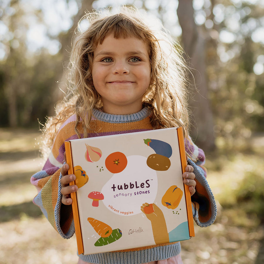 Olli Ella Tubble Stones in Vibrant Veggies showing children holding the vegetable stones