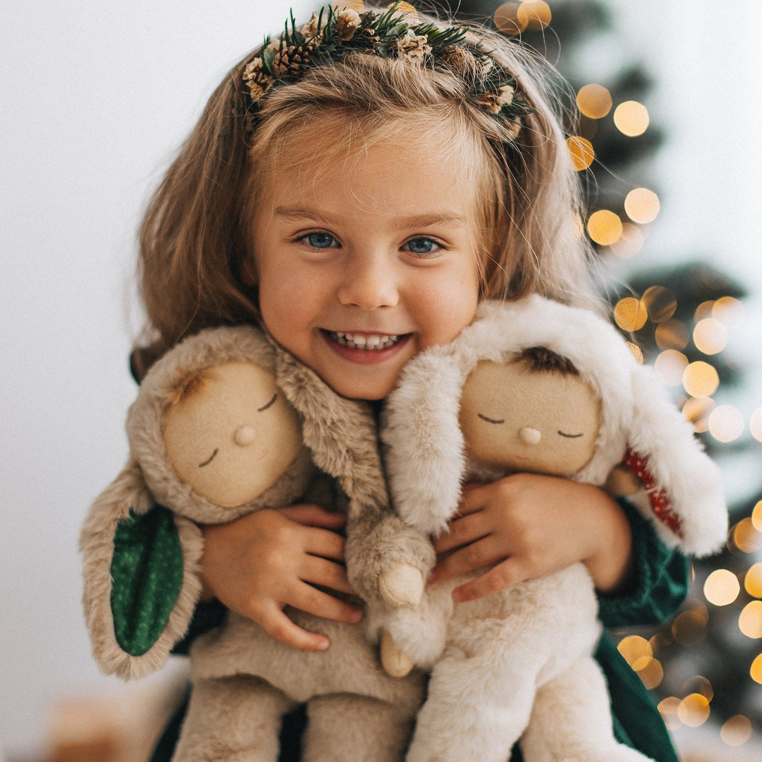 in a green wreath with white flowers