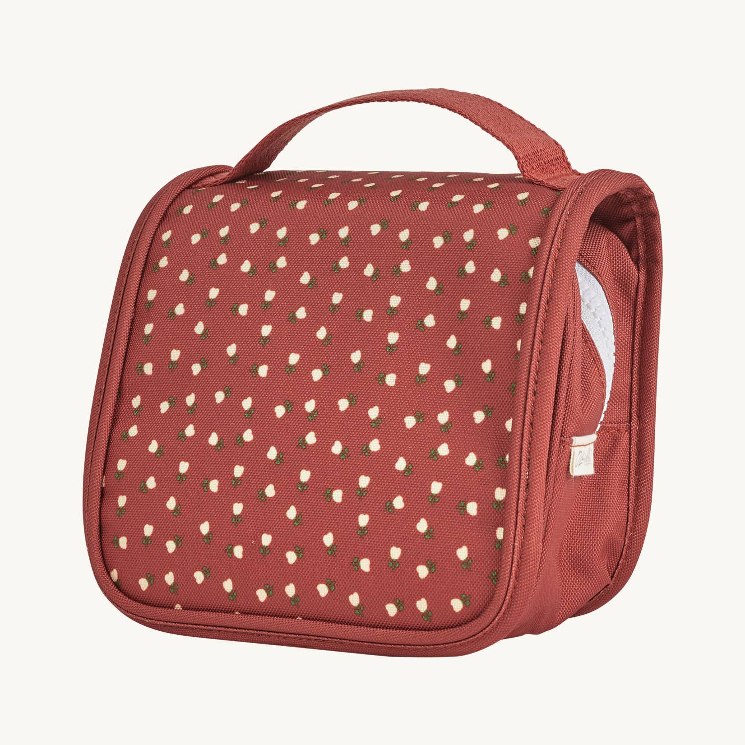 Olli Ella See-Ya Washbag in Sweethear Red design with small white flowers on a red fabric background