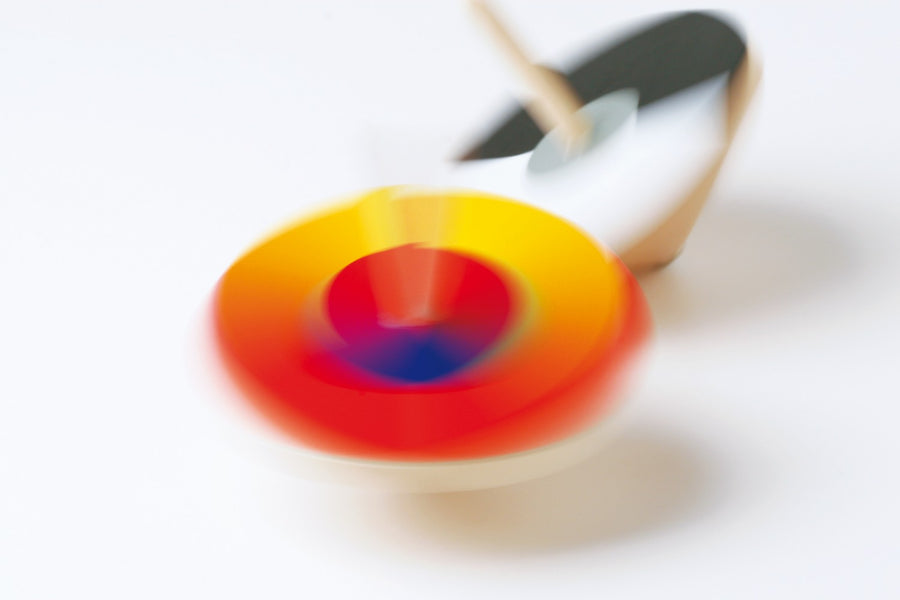 Naef Optical Mixer Of Colours spinning top blurred whilst in motion