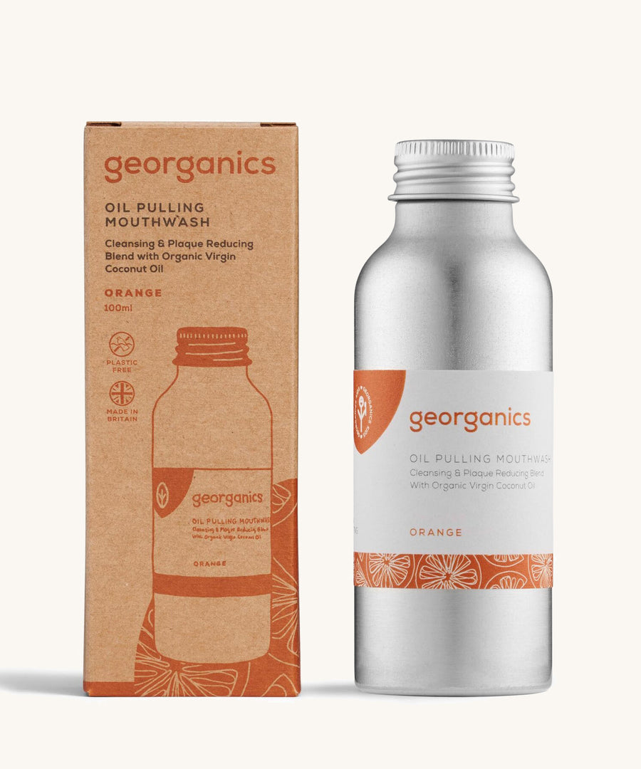 A bottle of the Georganics orange oil pulling mouthwash with the box