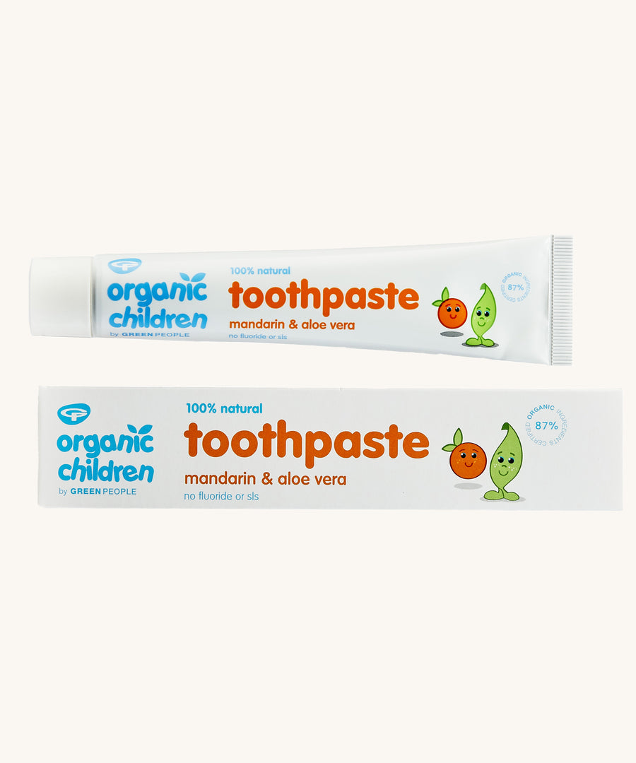 Organic Babies Toothpaste Mandarin & Aloe Vera on a plain background. 