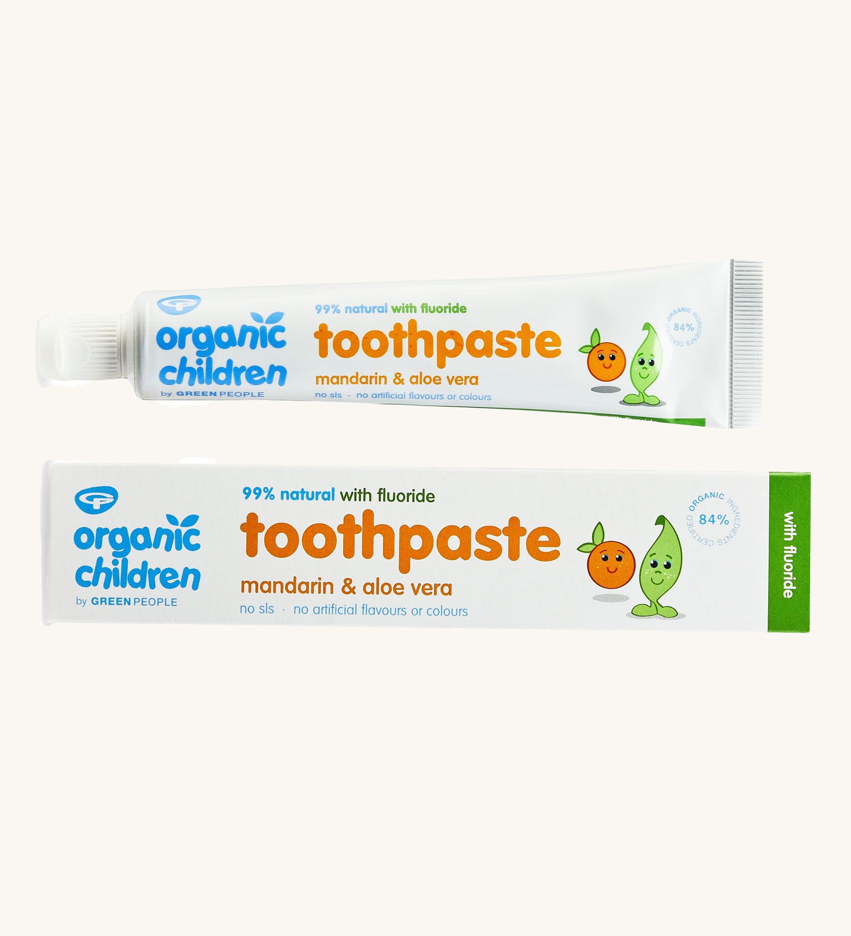 Organic Children Toothpaste Mandarin & Aloe Vera with Fluoride showing the tube next to the cardboard on a plain background. 