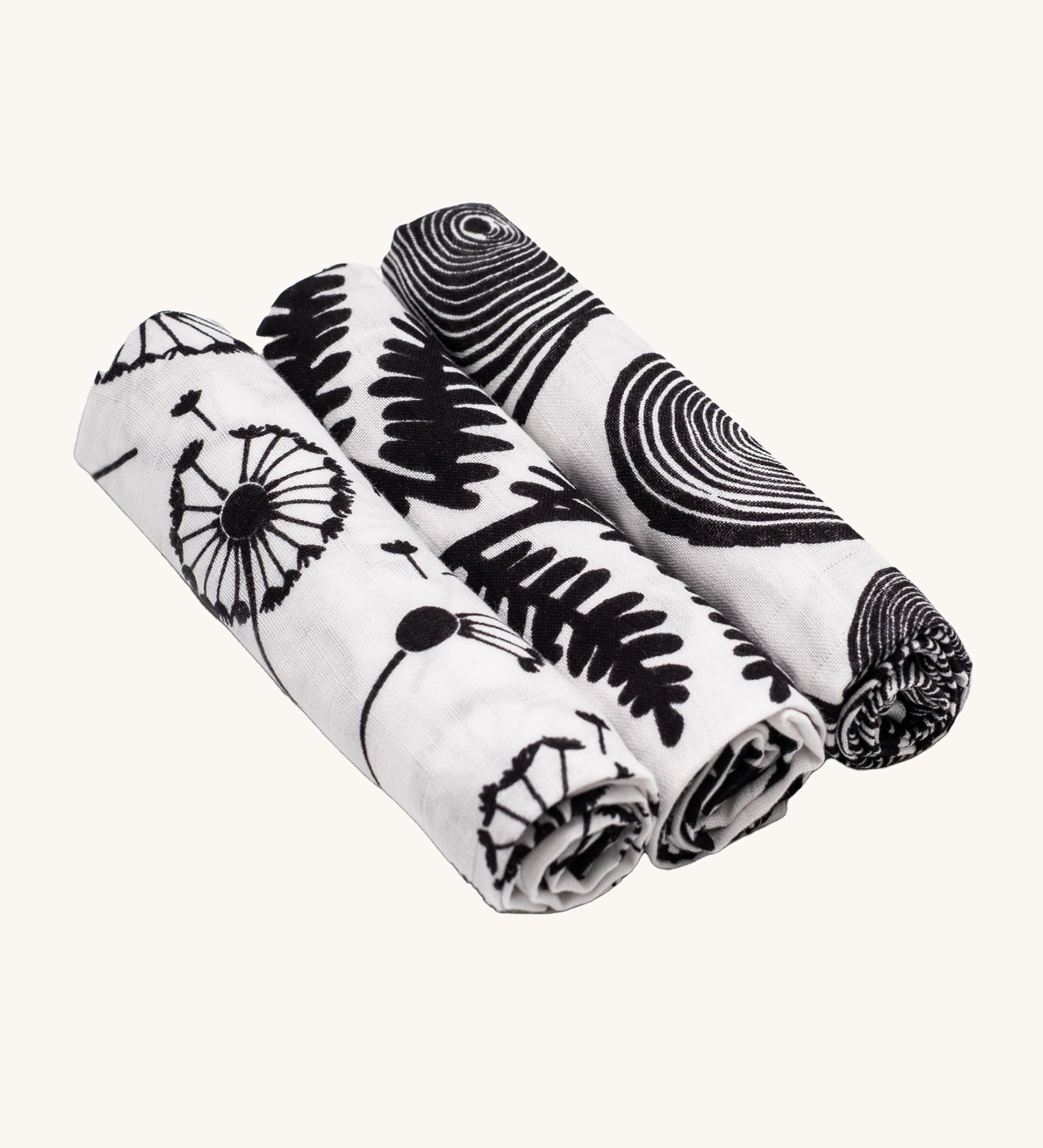 Etta Loves Organic Cotton Baby Muslin Squares 3 Pack - Plant, from left to right is Dandelion, Fern and Tree Ring, in striking black and white print