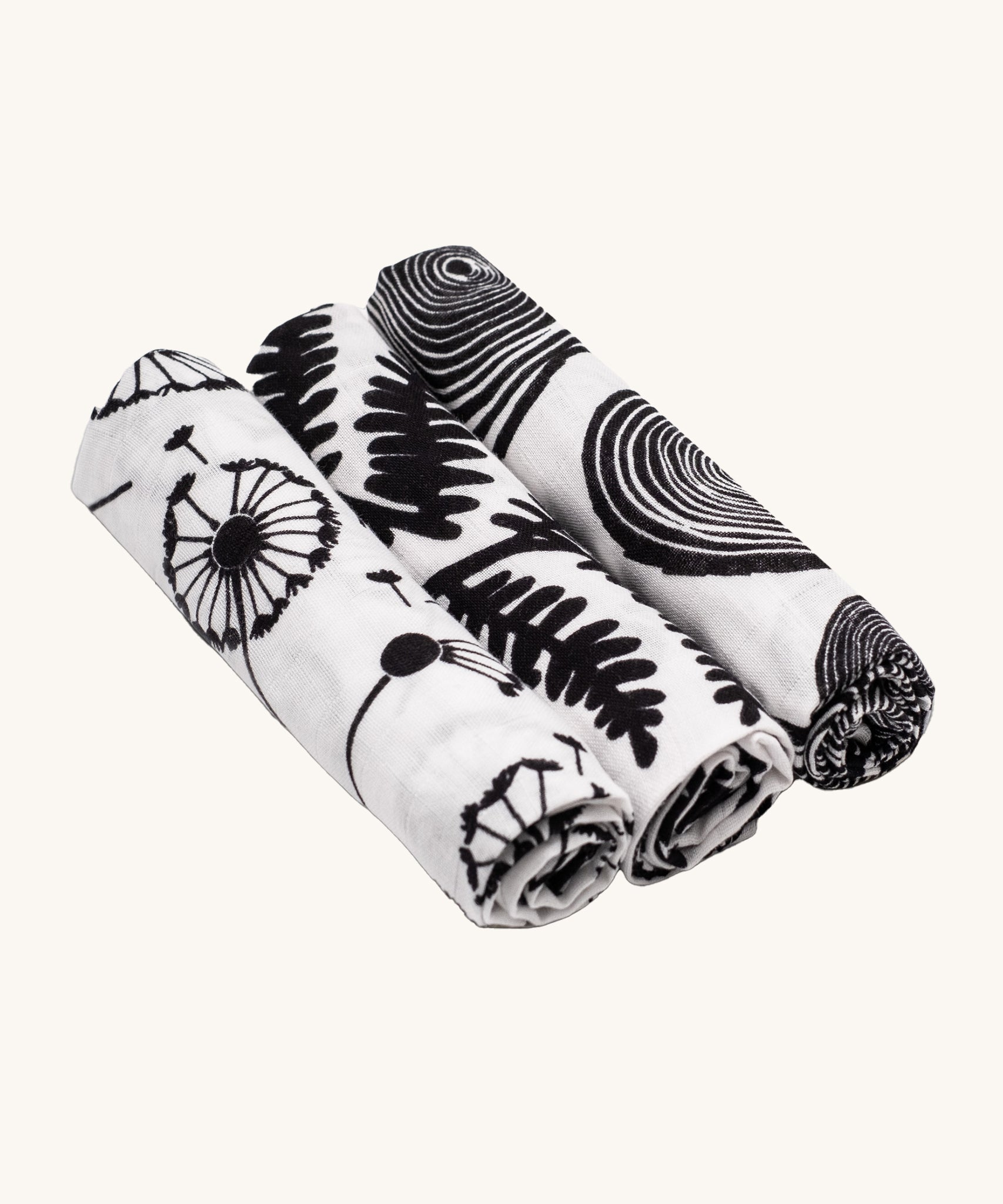 Etta Loves Organic Cotton Baby Muslin Squares 3 Pack - Plant, from left to right is Dandelion, Fern and Tree Ring, in striking black and white print